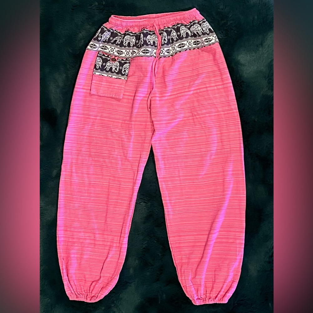 One of a kinda rasta pants. Each style is different. Worn once!
